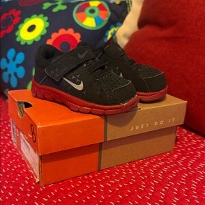 Nike Kids Black Sneakers with Red Soles